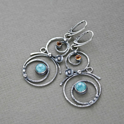 Earrings with blue and orange stones
