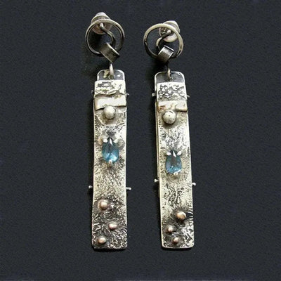 Handmade earrings made of blue stone