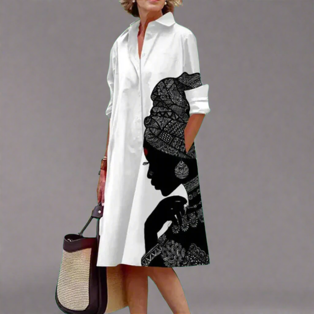 Revel - Knee length dress with character art pattern for women.