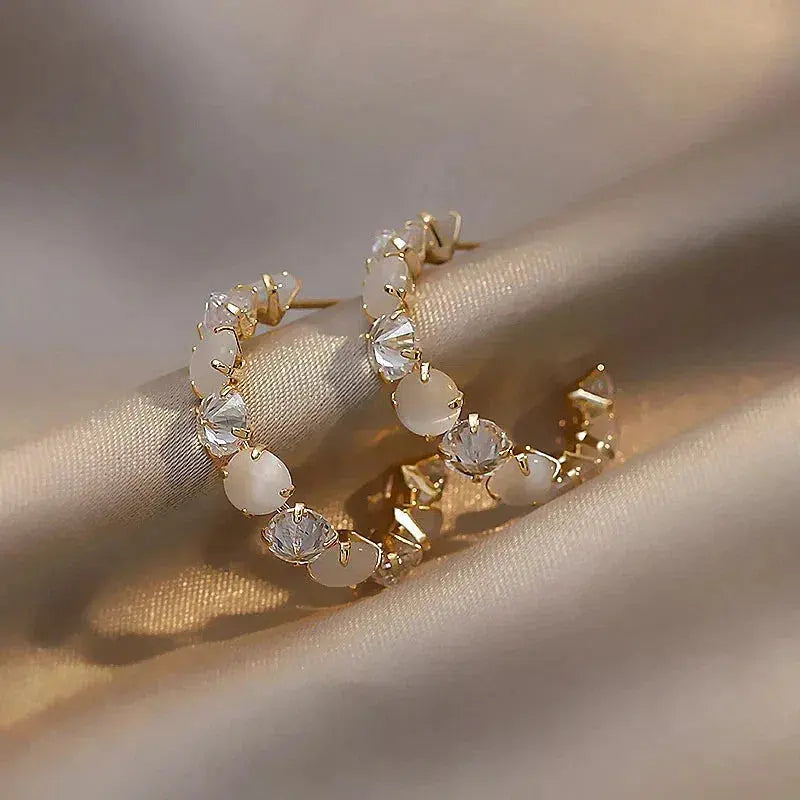White opal with zirconia earrings in gold