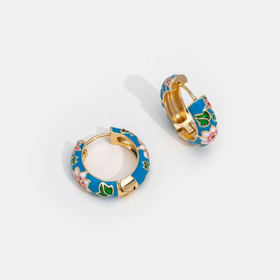 Gold circle earrings with flower design