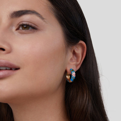 Gold circle earrings with flower design