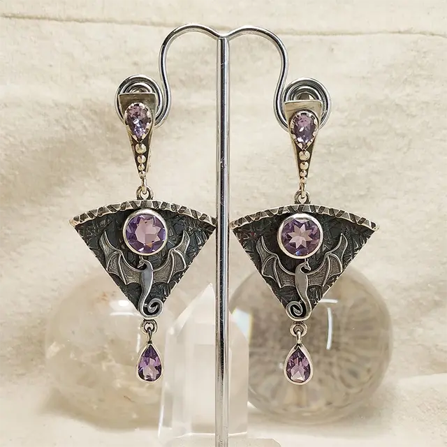 Vintage earrings made of silver and purple zirconia