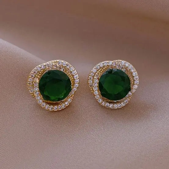 Green earrings with shiny spiral