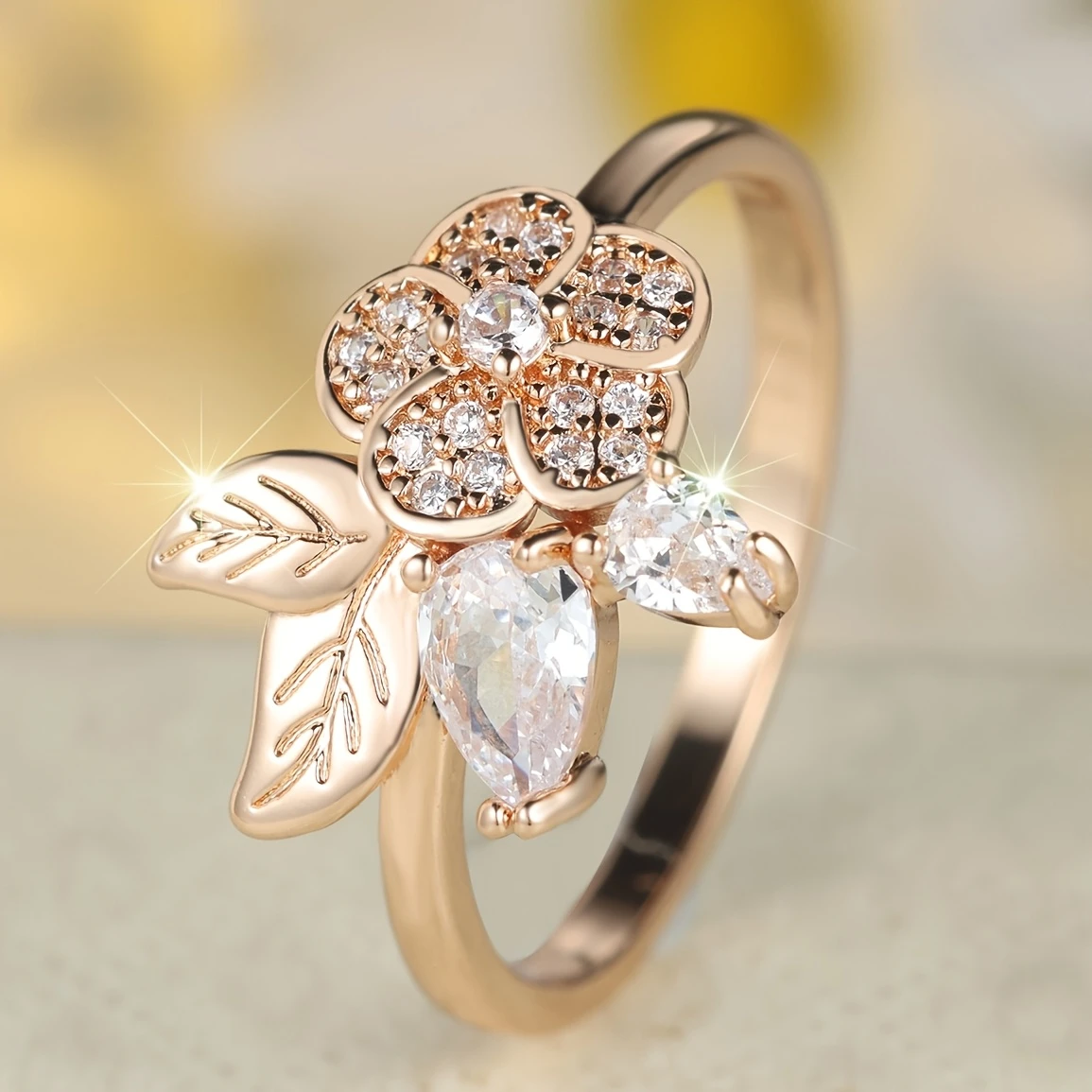 Golden ring with flower and crystals