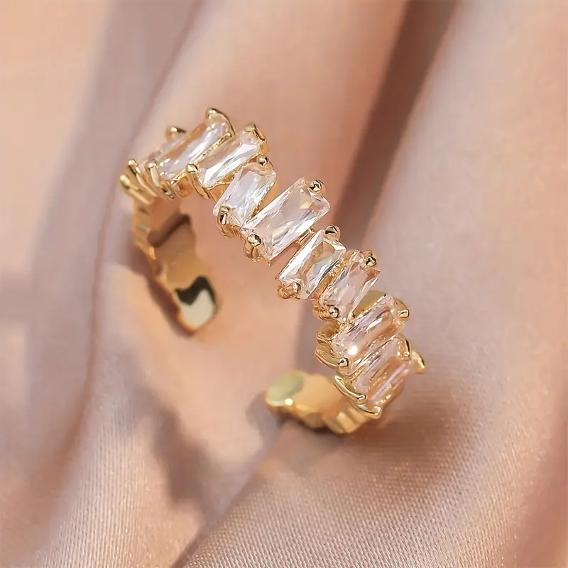 Gold ring with white glass crystal